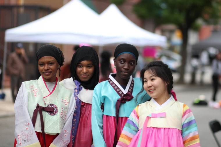 Democracy Prep students wear hanbok, or traditional Korean dresses, at the annual Korean Street Fair in New York.