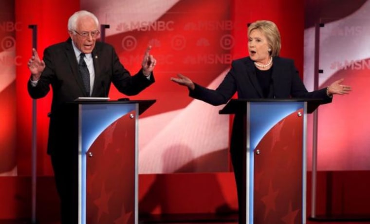 Democratic U.S. presidential candidate Senator Sanders and former Secretary of State Clinton speak as they discuss issues during the Democratic presidential candidates debate sponsored by MSNBC at the University of New Hampshire in Durham