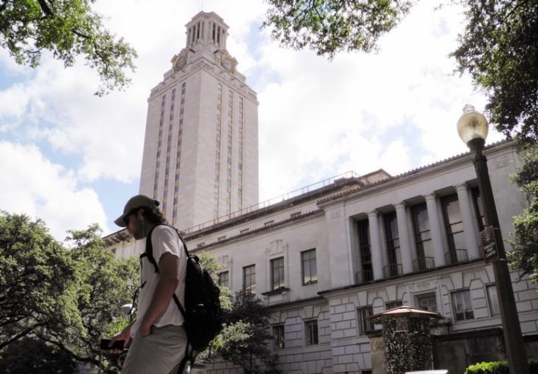 A student walks at the University of Texas campus in Austin