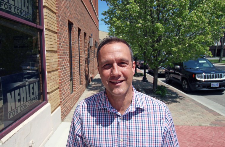 In this photo taken Thursday, May 19, 2016, in Kenosha, Wis. Paul Nehlen, a Republican, stands outside his campaign office. He plans to take on U.S. Rep. Paul Ryan, also a Republican, in the Aug. 9 primary. 
