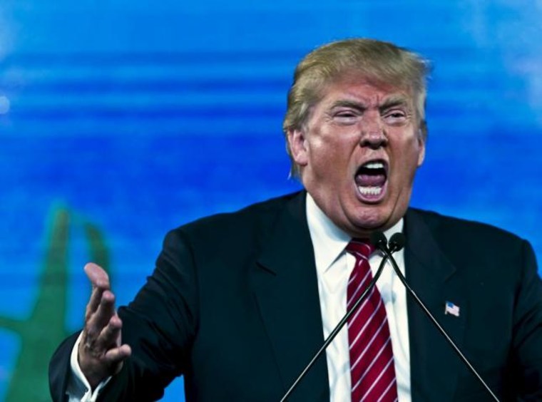 Republican Presidential candidate Trump reacts as he speaks at the 2015 FreedomFest in Las Vegas