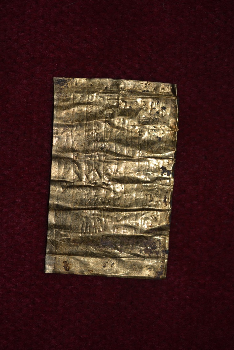 Image: A gold-inscribed "curse tablet"