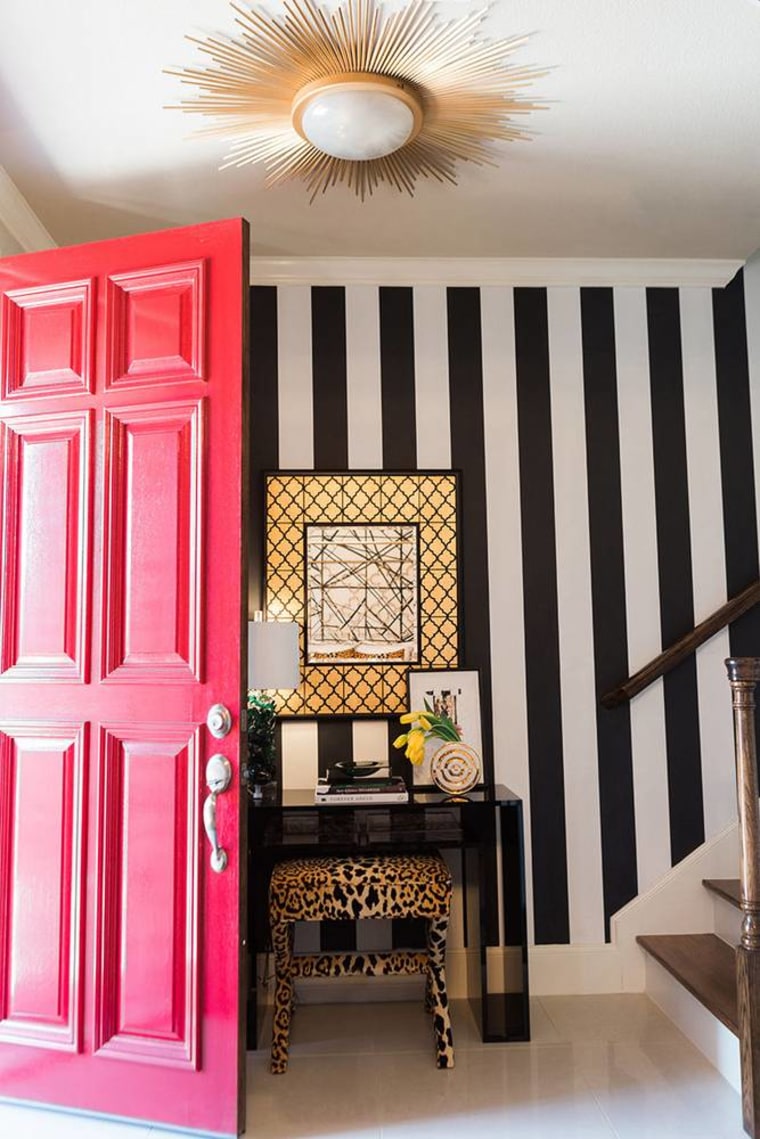 A grand red door is one way to make a showstopping entrance to a Leo's house.