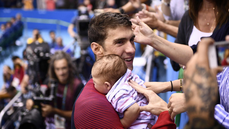 Michael Phelps holds his son Boomer