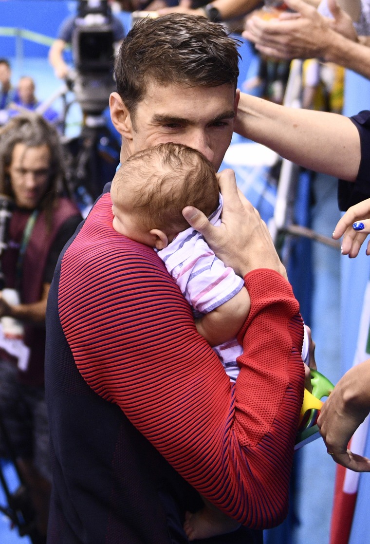 Michael Phelps holds his son Boomer