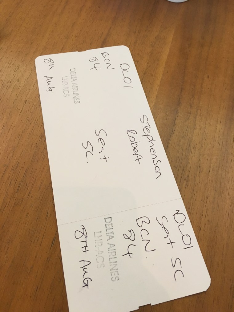 Image: A handwritten Delta boarding pass, issued because the airline's computer system is down, given to passenger Rob Stephenson, 42, of Ann Arbor, Michigan at London's Heathrow Airport.