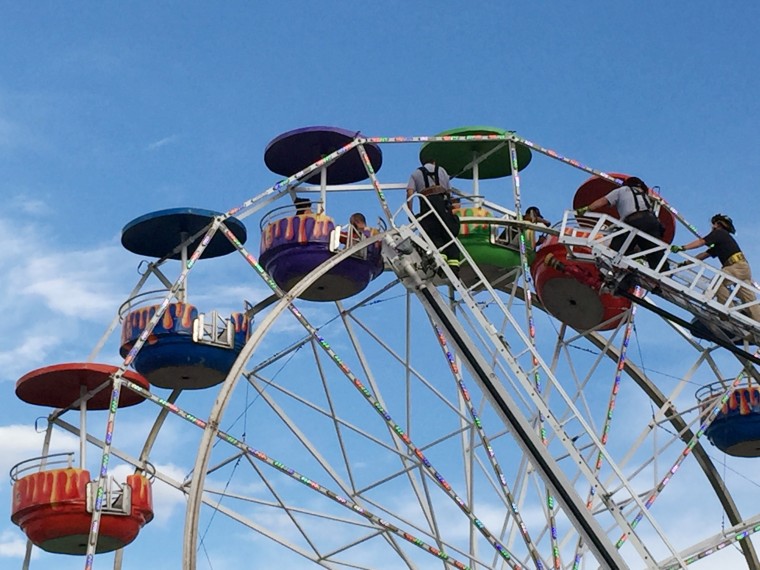 Image: Emergency crews unload the ferris wheel at the Greene County Fair in Greeneville, Tenn.