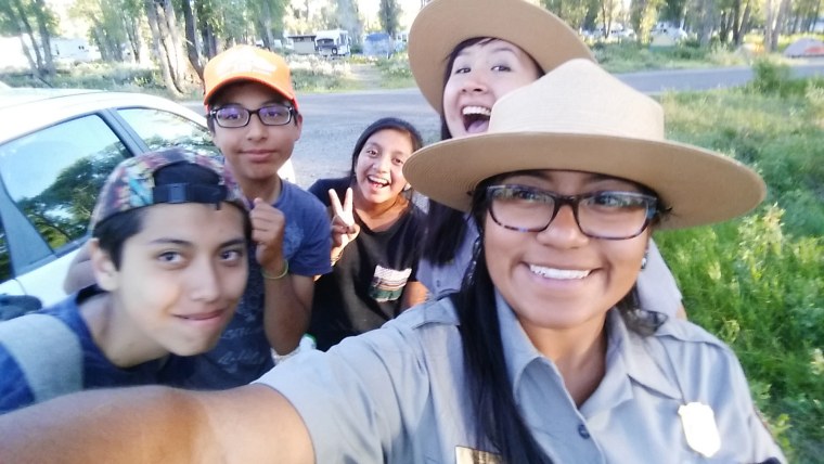 Image: Ranger Millie Jimenez poses for a selfie with Pura Vida middle school students