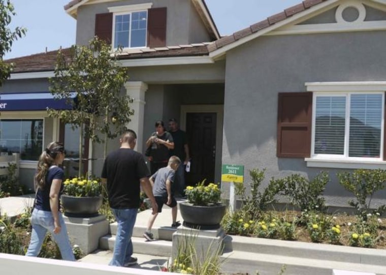Prospective home owners tour a community being developed by builder D.R. Horton in Jurupa Valley, California