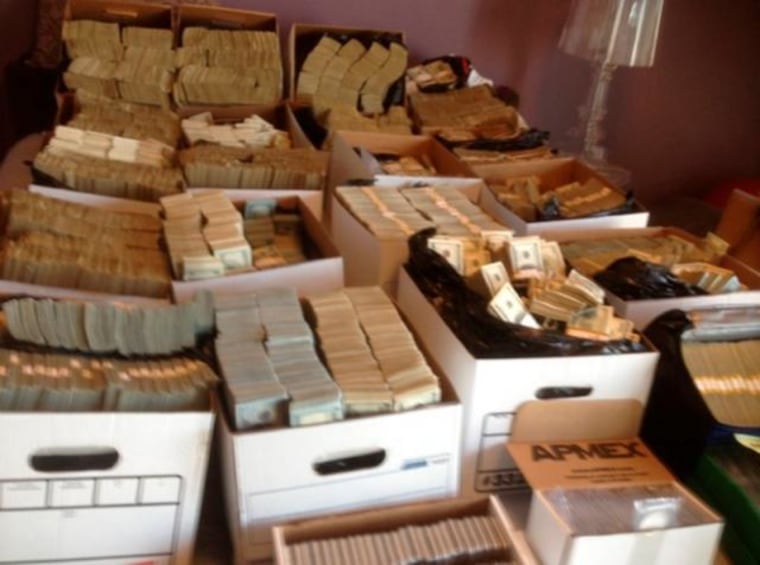 Department of Justice handout photo shows boxes containing U.S. currency seized during a raid in the Los Angeles Fashion District