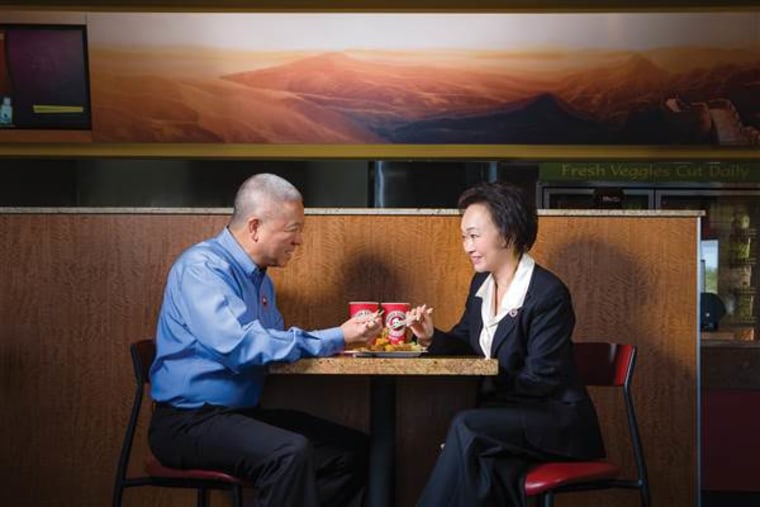 The co-founders of Panda Restaurant Group, Andrew and Peggy Cherng, eat at a Panda Express location.