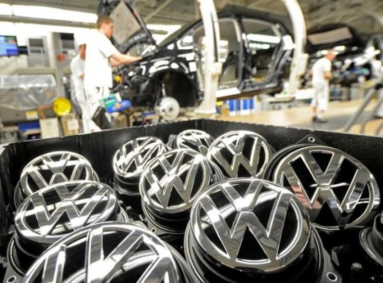 Emblems of VW Golf VII car are pictured in a production line at the plant of German carmaker Volkswagen in Wolfsburg