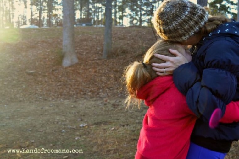 Mom hugging child