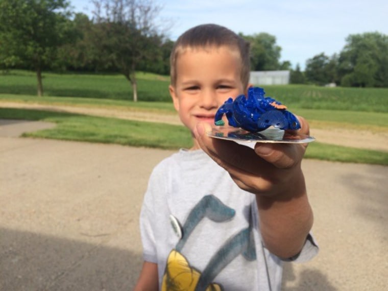 Boy holding a toy