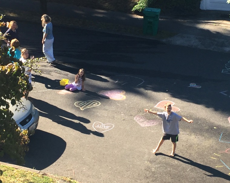 kids washing away graffiti