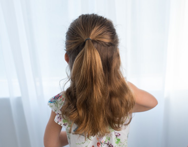 Half braided up-do hairstyle for kids