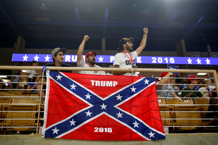 Image: Brandon Miles, Brandon Partin and Michael Miles cheer before Republican U.S. presidential nominee Donald Trump attends a campaign rally at the Silver Spurs Arena in Kissimmee, Florida