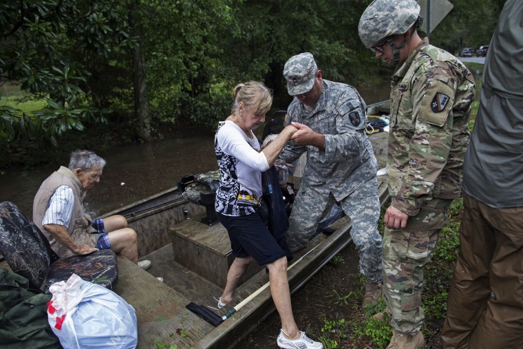 Image: Members of the Louisiana Army National Guard rescue people