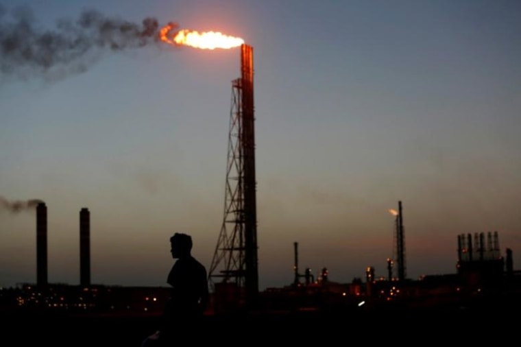A man stands close to the Cardon refineryn which belongs to the Venezuelan state oil company PDVSAn in Punto Fijo