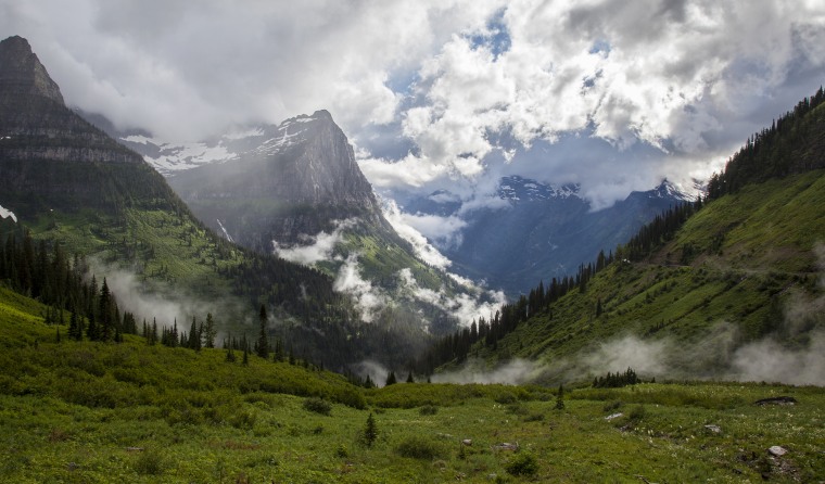 Clouds sweep past Mount Oberlin and Mount Cannon along the Going-To-The-Sun Road in Glacier National Park.