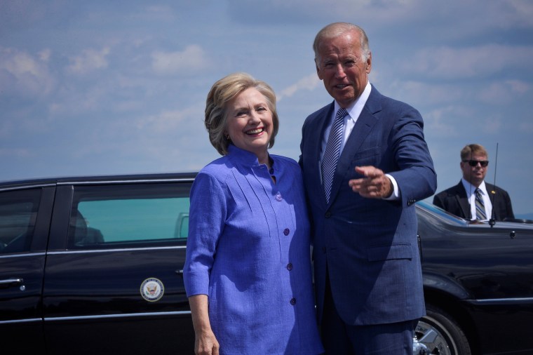 Image: Democratic presidential nominee Hillary Clinton welcomes Vice President Joe Biden as he disembarks from Air Force Two for a joint campaign event in Scranton, Pennsylvania
