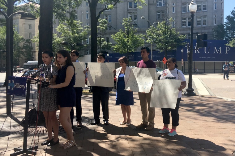 Sisters Natalia  and Alejandra Rodas Calderon, who are both enrolled in the Deferred Action for Childhood Arrivals (DACA) program, hold a news conference in front of the site of the Old Post Office in Washington, DC that is being developed into a luxury hotel by GOP nominee Donald Trump. The two girls, as immigrants without legal status in the U.S. can't vote, but the Clinton campaign has launched a campaign in which immigrants like them will register voters for Hillary Clinton.