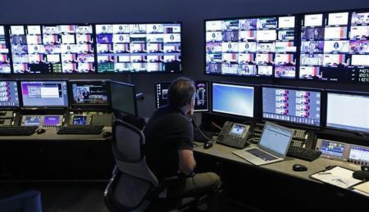 A technician works in the "Acquisition Room", which receives televison feeds from around the world, during an event to mark the opening of the new Univision and Fusion television networks newsroom in Doral
