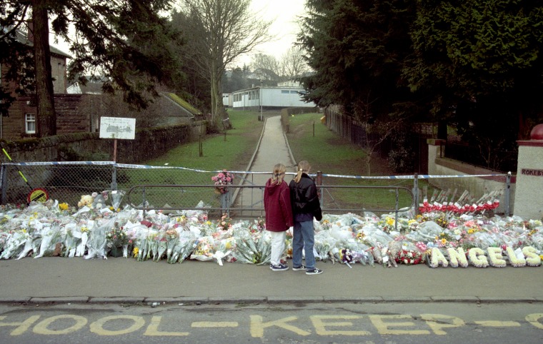 Image: Two girls outside Dunblane Primary School in 1996