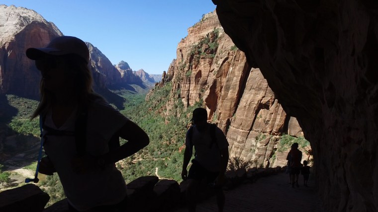 Image: Hikers climb along the Angels Landing trail in Zion National Park
