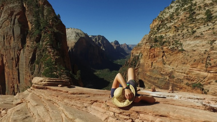 Image: A hiker rests along the Angels Landing trail