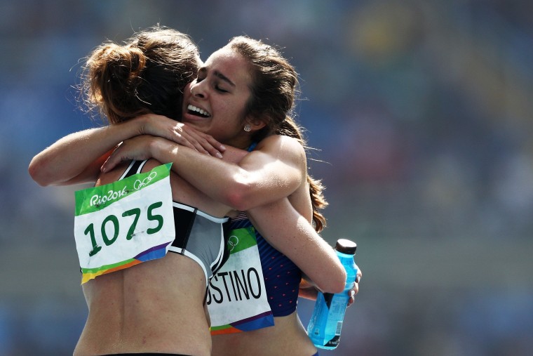 Image: Abbey D'Agostino of the United States (R) hugs Nikki Hamblin of New Zealand