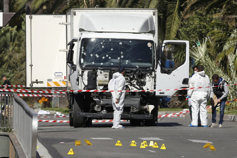 Image: Investigators examine truck used in Nice attack
