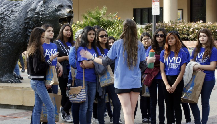 UCLA campus tour guide Samantha St. Germain leads prospective college-bound high school seniors on a campus tour in Los Angeles on Feb. 26, 2015.