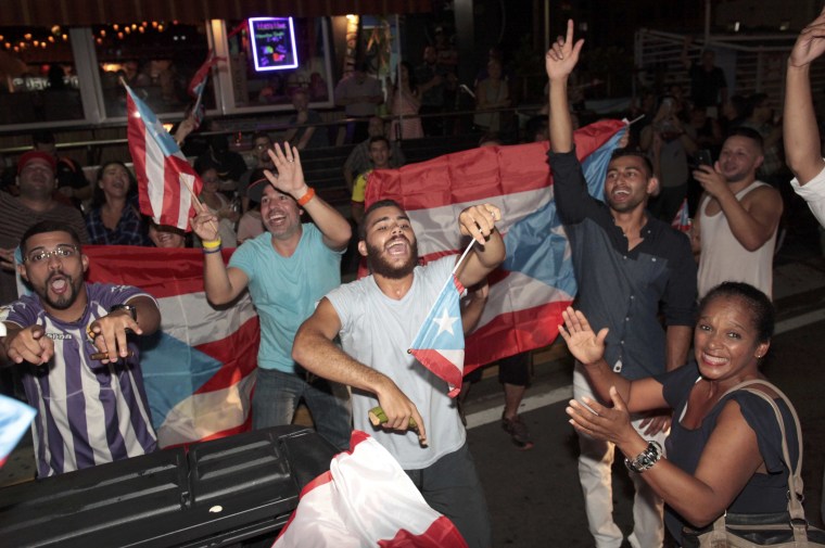 Puerto Ricans celebrate the gold medal won by Monica Puig