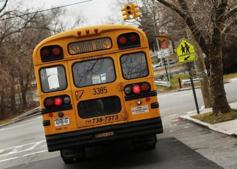 A school bus used for transporting New York City public school students is seen driving down 135th avenue in the Queens borough of New York