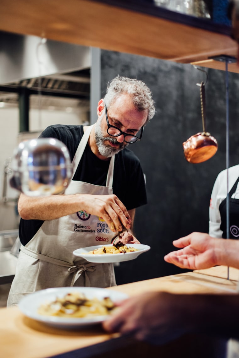 Chef Massimo Bottura prepares food at the? Refettorio Gastromotiva. (Angelo Dal Bo / Gastromotiva)