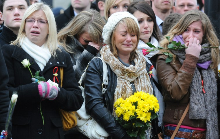 Image: Mourners react as hearse carrying British soldier Robert Hayes is driven through Wootton Bassett on Jan. 11, 2010