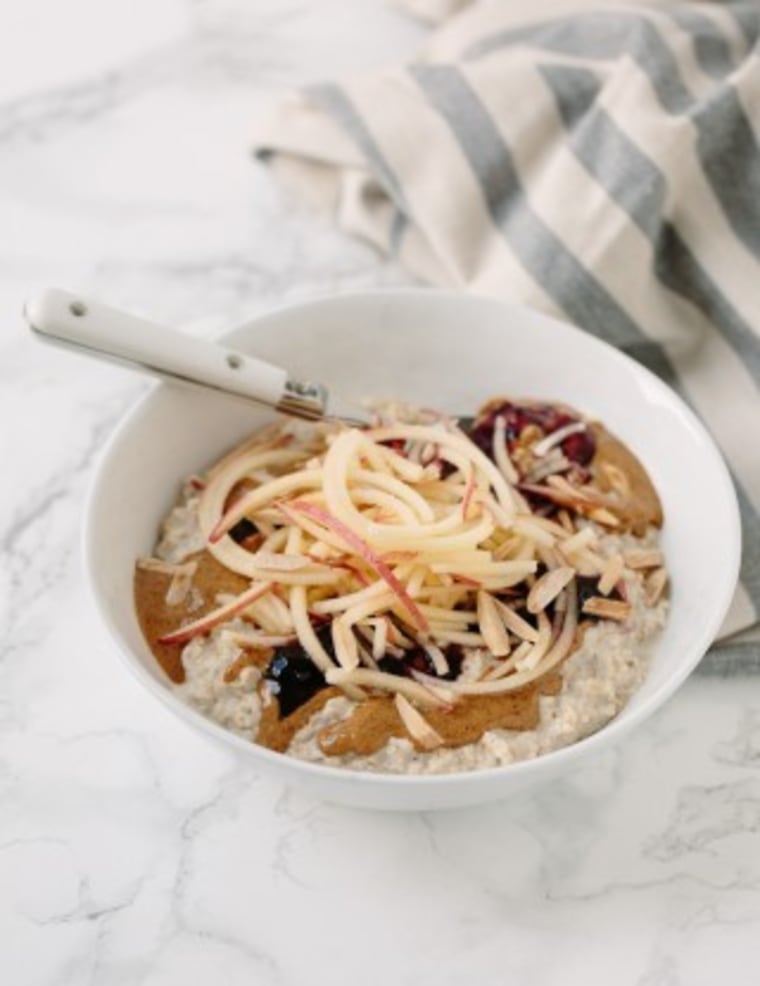 Oatmeal bowl with spiralized apples and toasted almonds