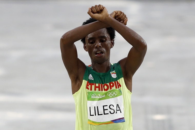 Image: Feyisa Lilesa makes his protest in Rio