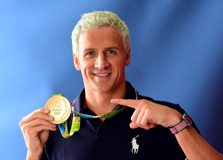 Ryan Lochte of the United States poses with his gold medal on the Today Show