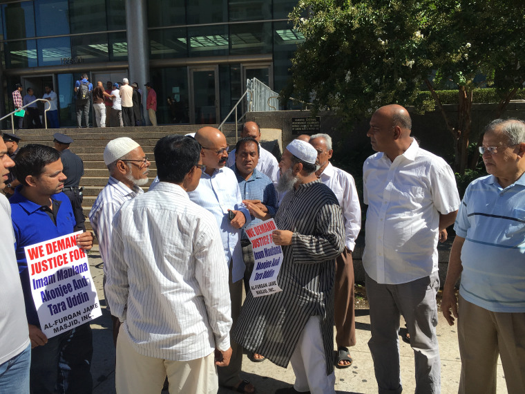 Supporters of Imam Maulana Akonjee and friend Thara Uddin, who were murdered last weekend, gather outside Queens Supreme Court in New York Monday after a court hearing for Oscar Morel, who was charged in the shootings.