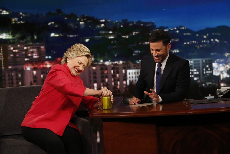 Hillary Clinton opens a pickle jar for Jimmy Kimmel on Monday, Aug. 22.