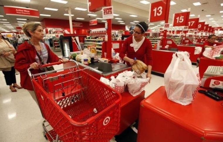 A Target employee checks out a customer at a store in Falls Church