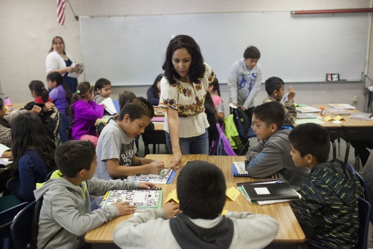 An exchange teacher from Mexico instructs refugee students.