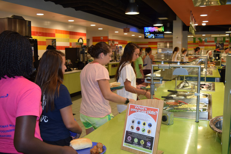 Freshman at Lebanon Valley College line up to learn about the various food stations.