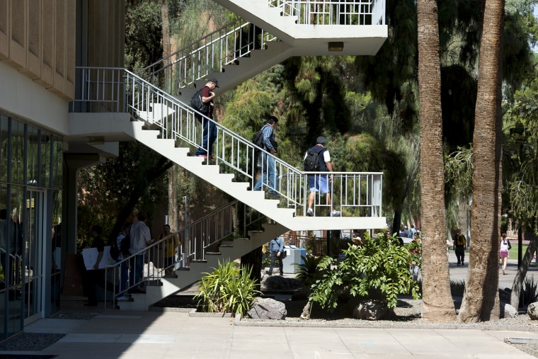 Arizona and 29 other states offer mail-in or excuse-free absentee ballots for college students. Shown here, students exit classrooms at Arizona State University's main campus in Tempe.