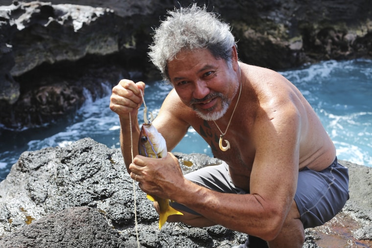 Image: G. Umi Kai uses a traditional Hawaiian hook to catch a fish