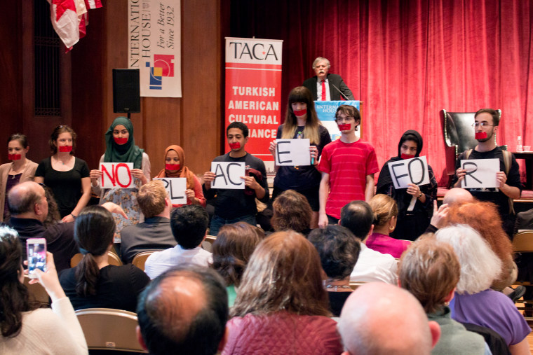 Members of the University of Chicago's Armenian Students Organization and supporters staged a protest at an International House during a lecture by University of Louisville professor Justin McCarthy, a scholar they say denies the Armenian Genocide.