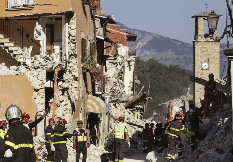 Image: Firefighters work in Amatrice, were more than 20 people were killed in the earthquake.