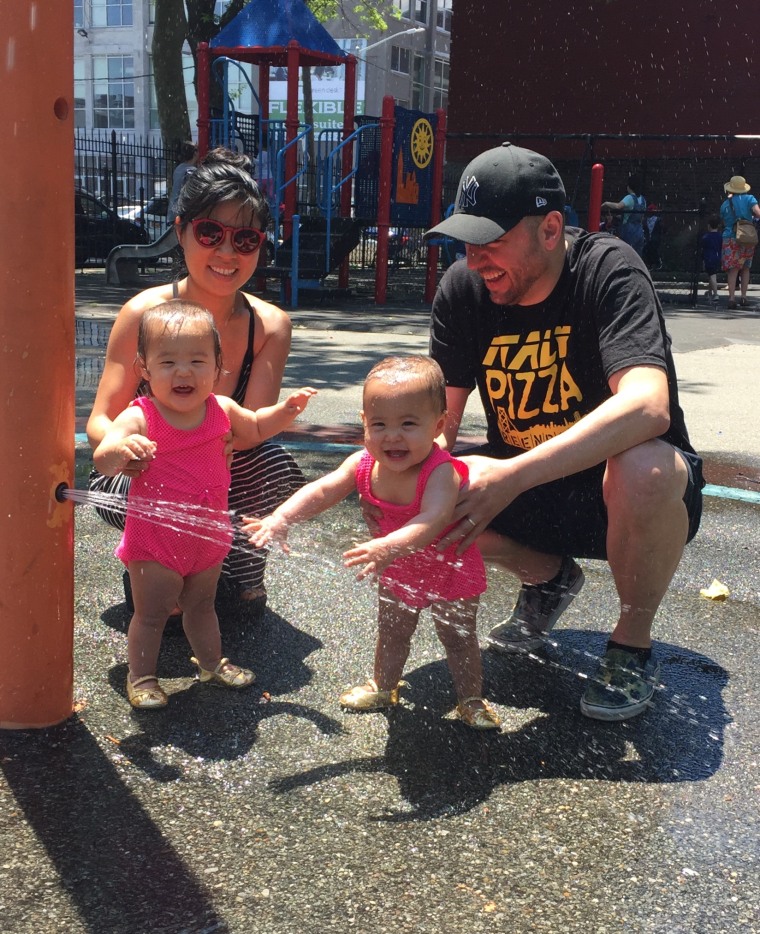 Koh and her husband, James Horowitz, play with their twin daughters, Amelia and Oneida.